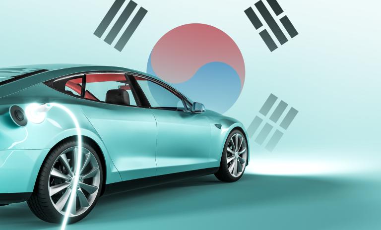 image of an electric car against the background of the South Korean flag