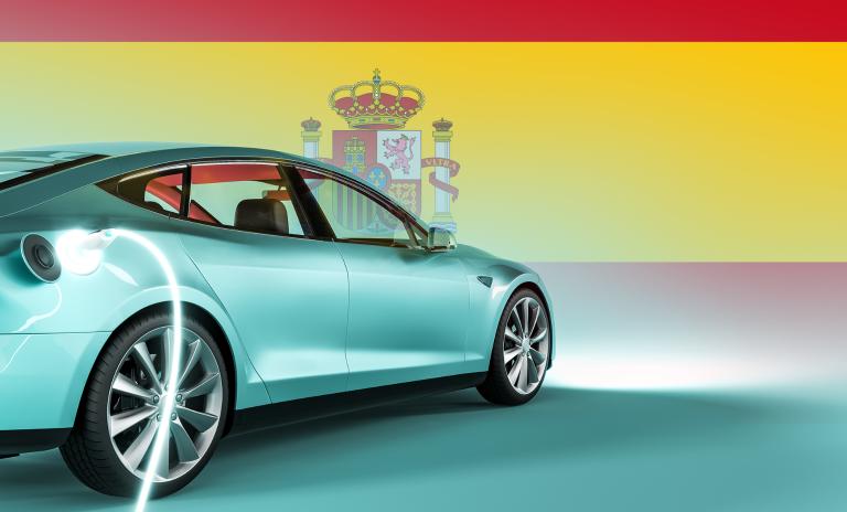 image of an electric car against the background of the spanish flag
