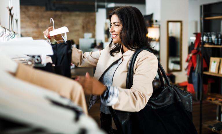woman choosing clothes in a store