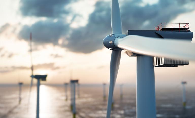 Bild von Windkraftanlagen, die mitten im Ozean stehen