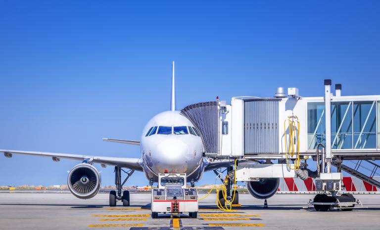 airplane with passenger ramp