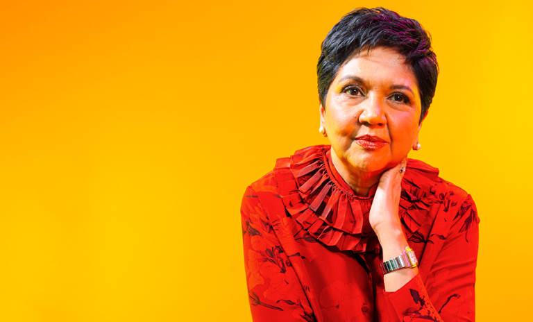 A photograph of Indra Nooyi, the former CEO of PepsiCo, looking towards the camera.