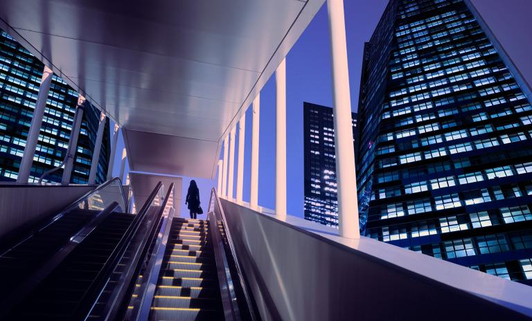 abstract graphic of two companies merging, with supplier networks and AI tools symbolizing procurement-driven synergies.