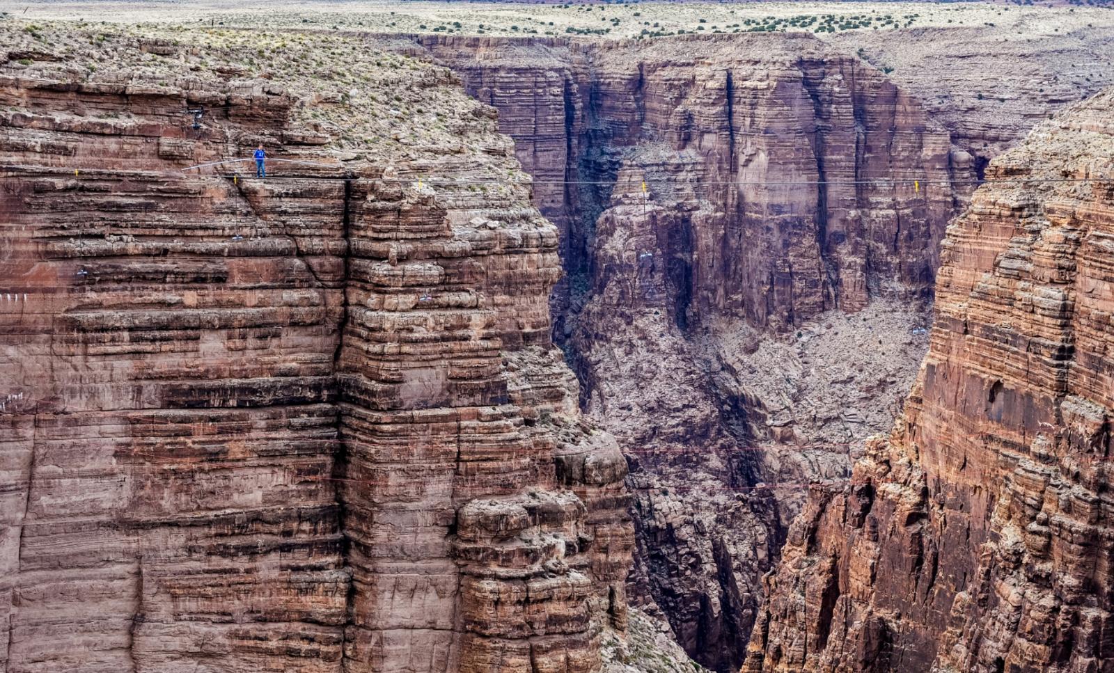 Risky business: Nik Wallenda has taken his high-wire performances to a whole new level with daring sky walks over landmarks including the Grand Canyon and Niagara Falls.