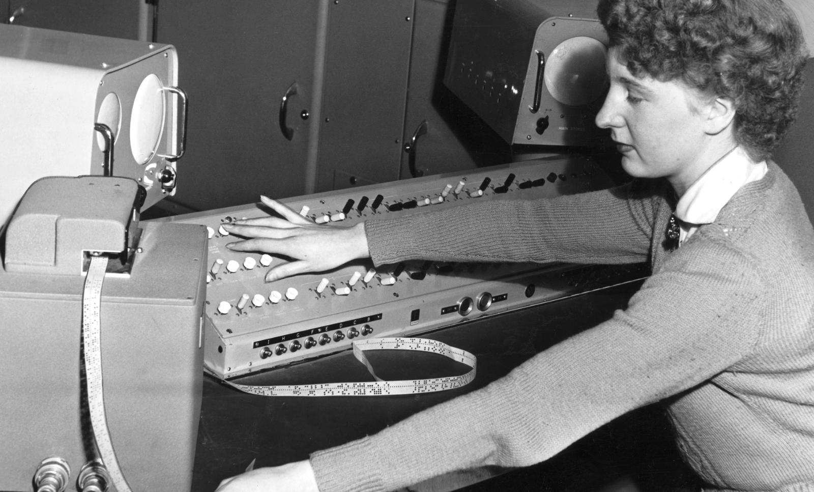 Feeding machine intelligence: A 21-year-old computer operator inserts instructions into a computer named “The Brain” in the UK in 1955.