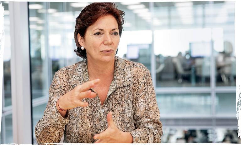 Nissan’s head of corporate strategy, partnerships and business development, Catherine Perez, sitting at a table