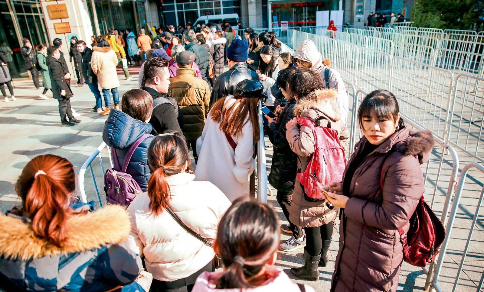 Former Ofo customers line up at the company’s headquarters to demand a refund