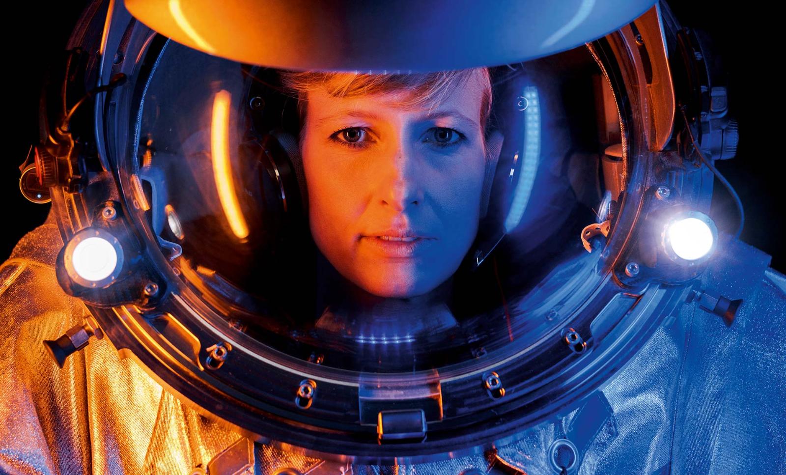 A head and waist shot of an analog astronaut showing detail of the uniform suit