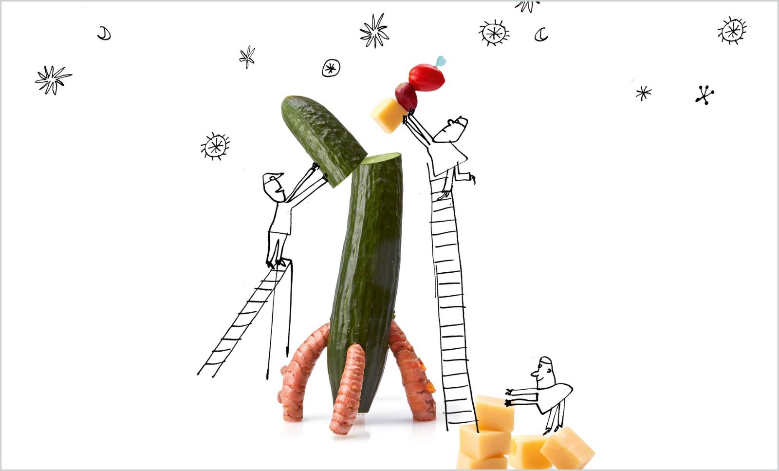Three cartoon figures build a rocket out of cheese and vegetables