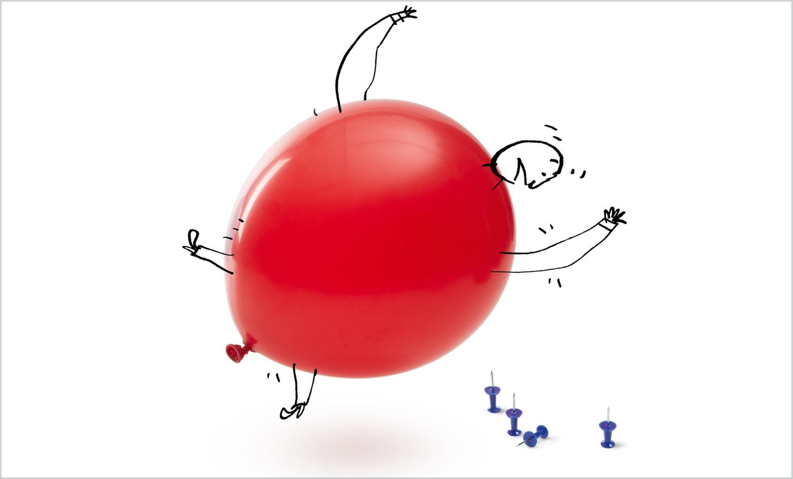 An anthropomorphic balloon begins to fall over a small pile of thumb tacks