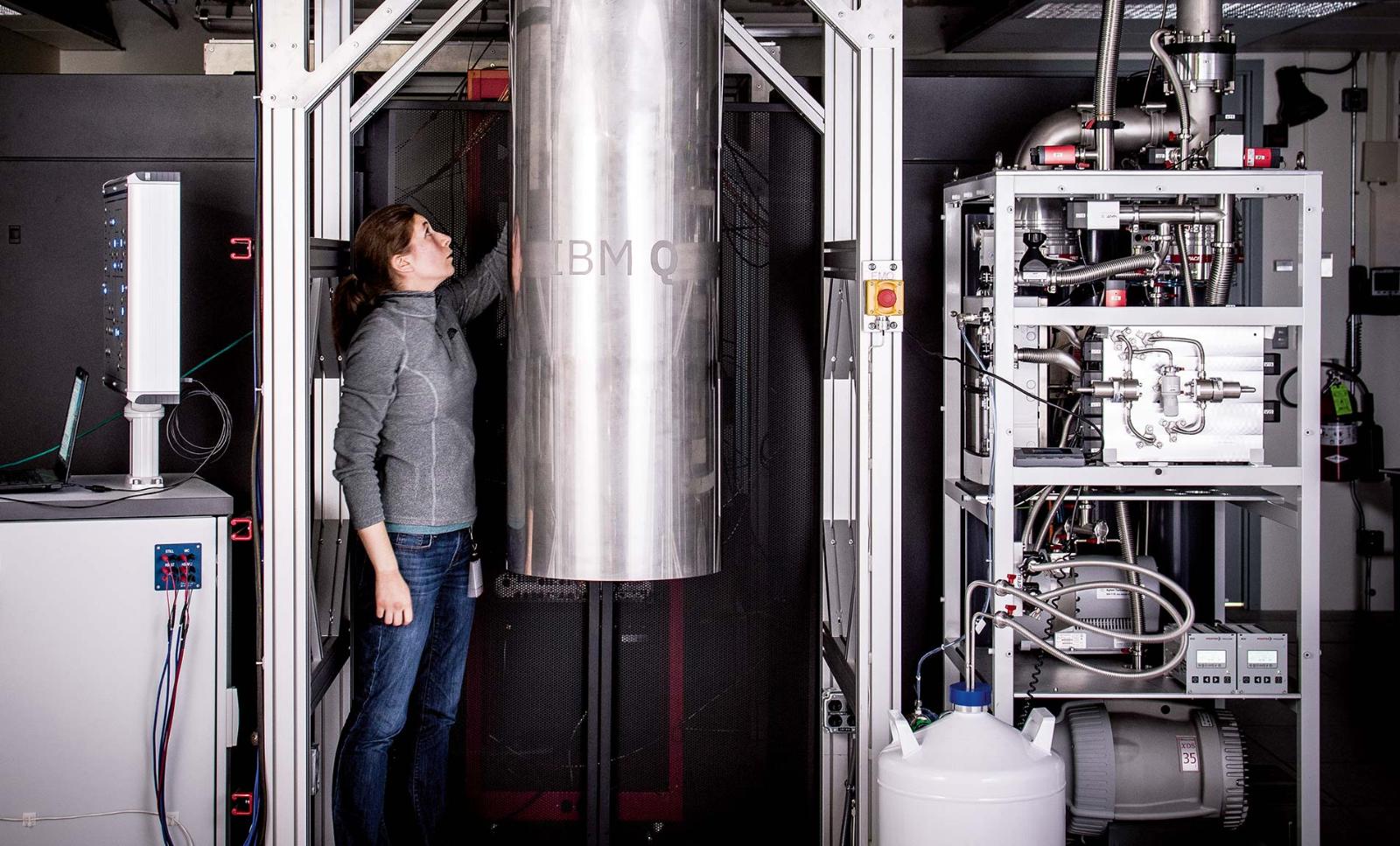 Reaching the real world: IBM Q team member Katie Pooley examines a cryostat containing a new prototype for a commercial quantum processor.