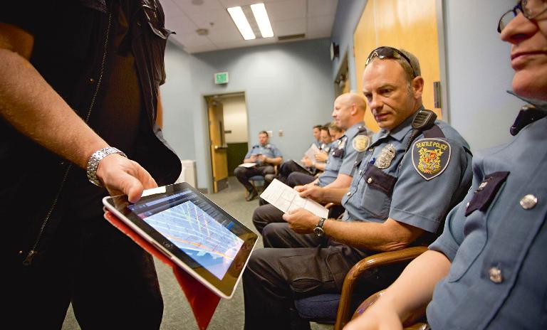 ON THE JOB: The Seattle Police Department also uses PrePol to help predict crime, but officers still have to go on the beat.