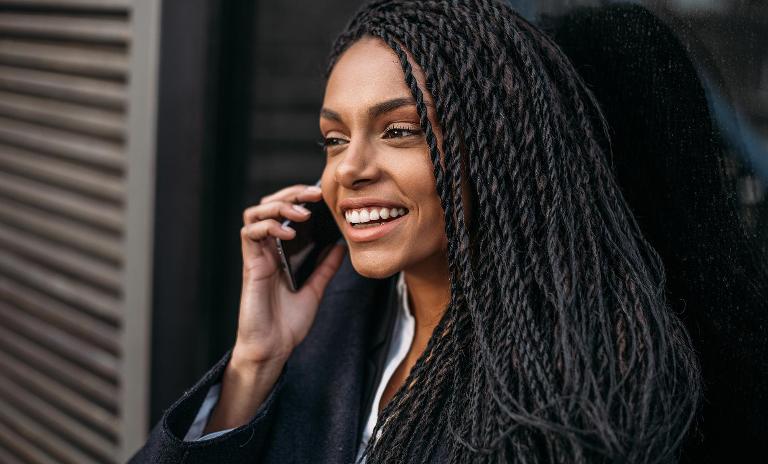 African woman with phone
