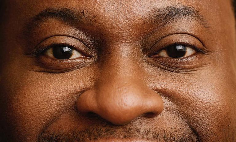 A close-up photo of a man’s face. (c) Robert Rieger