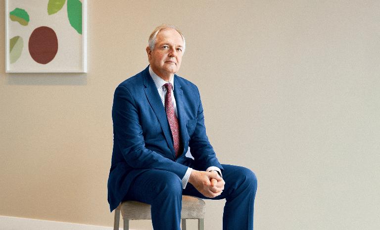 Co-founder and Chairman of Imagine Paul Polman sits on a chair with folded hands. (c) Ossi Piispanen