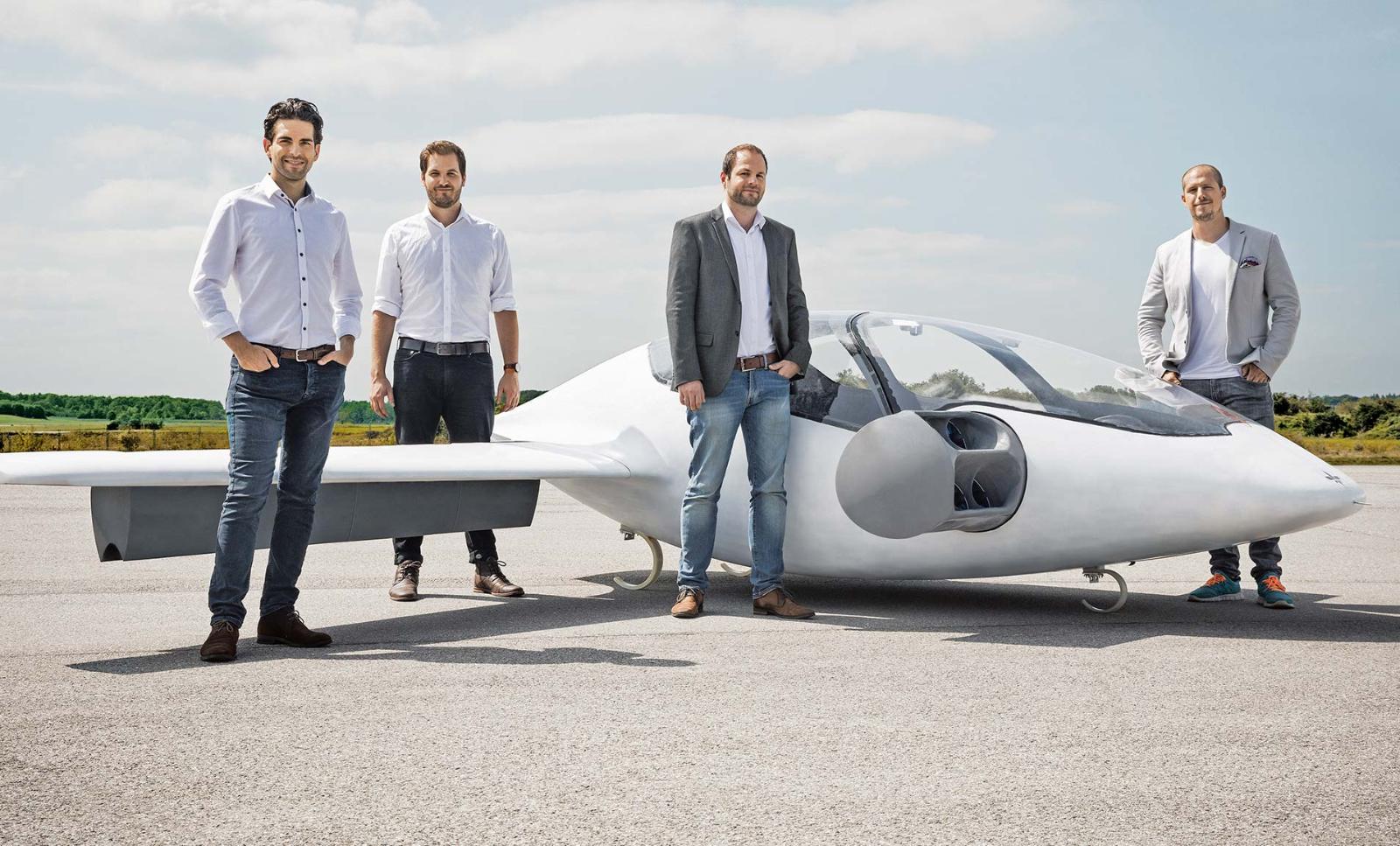 The four founders of German urban air mobility startup Lilium next to their prototype, the Eagle