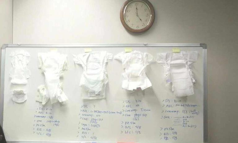 The white board with diapers and hygiene pads
