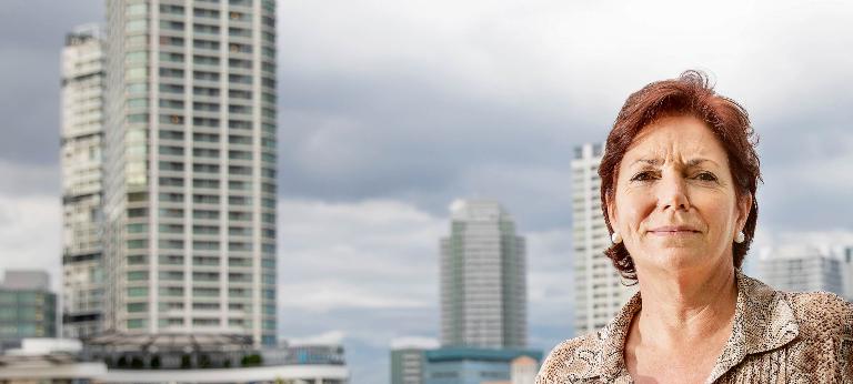 Catherine Perez of Nissan stands with a skyline behind her